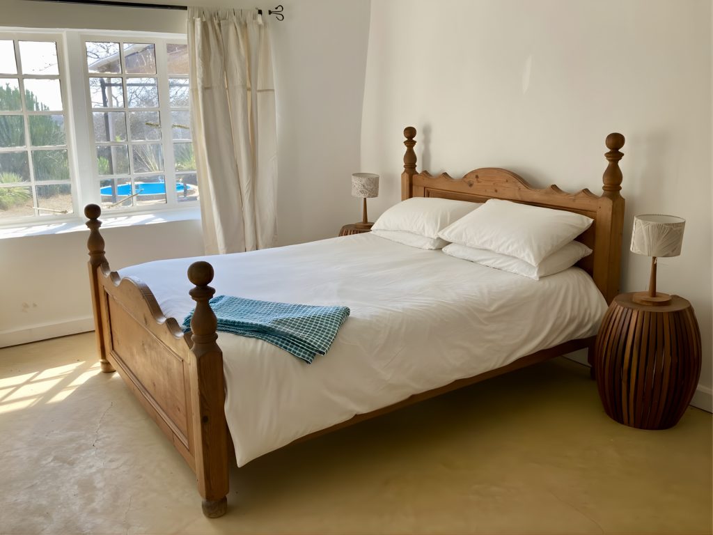 The master bedroom in our Giraffe Eco Cottage - stay with us!